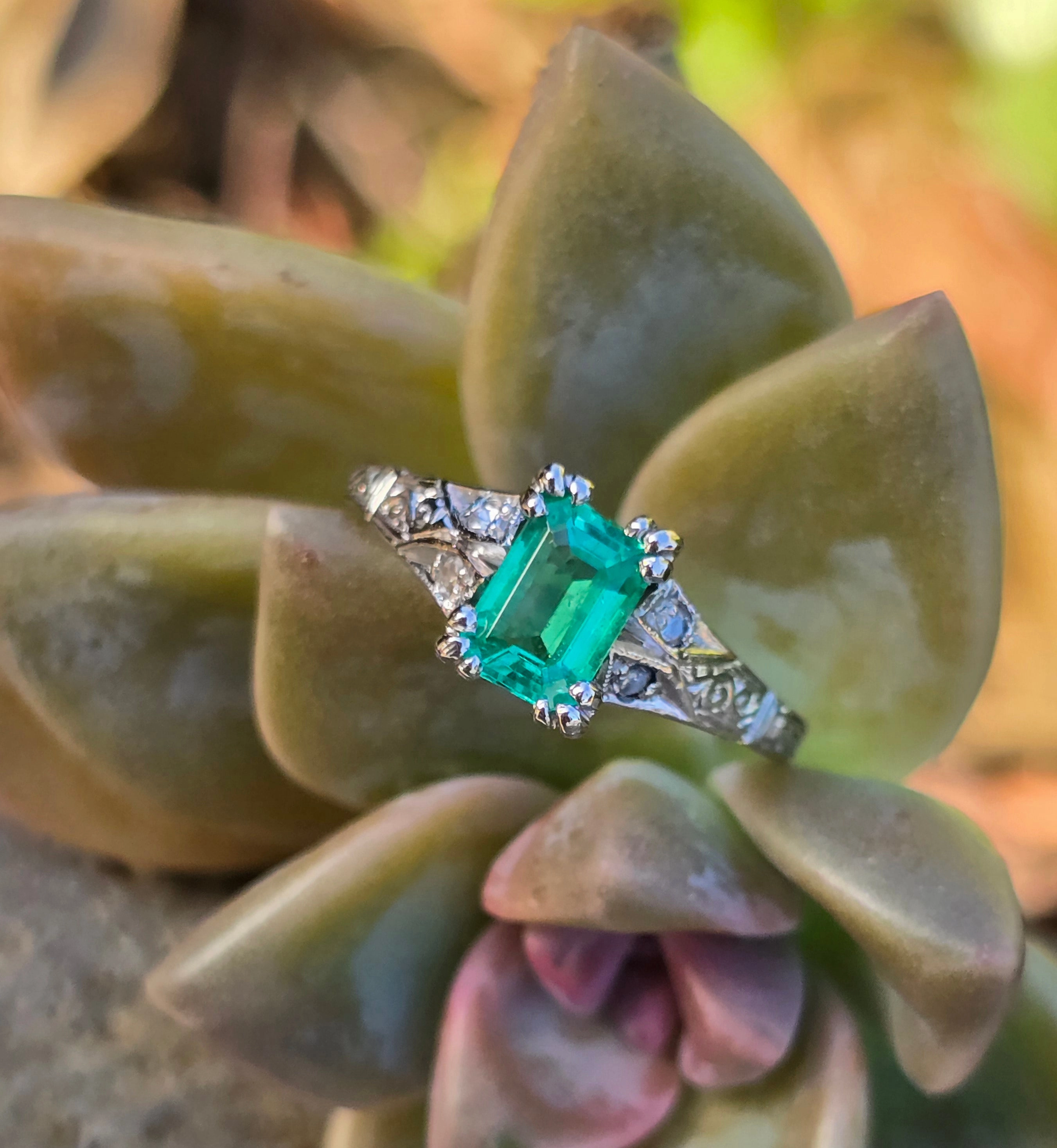 Platinum emerald and diamond estate ring