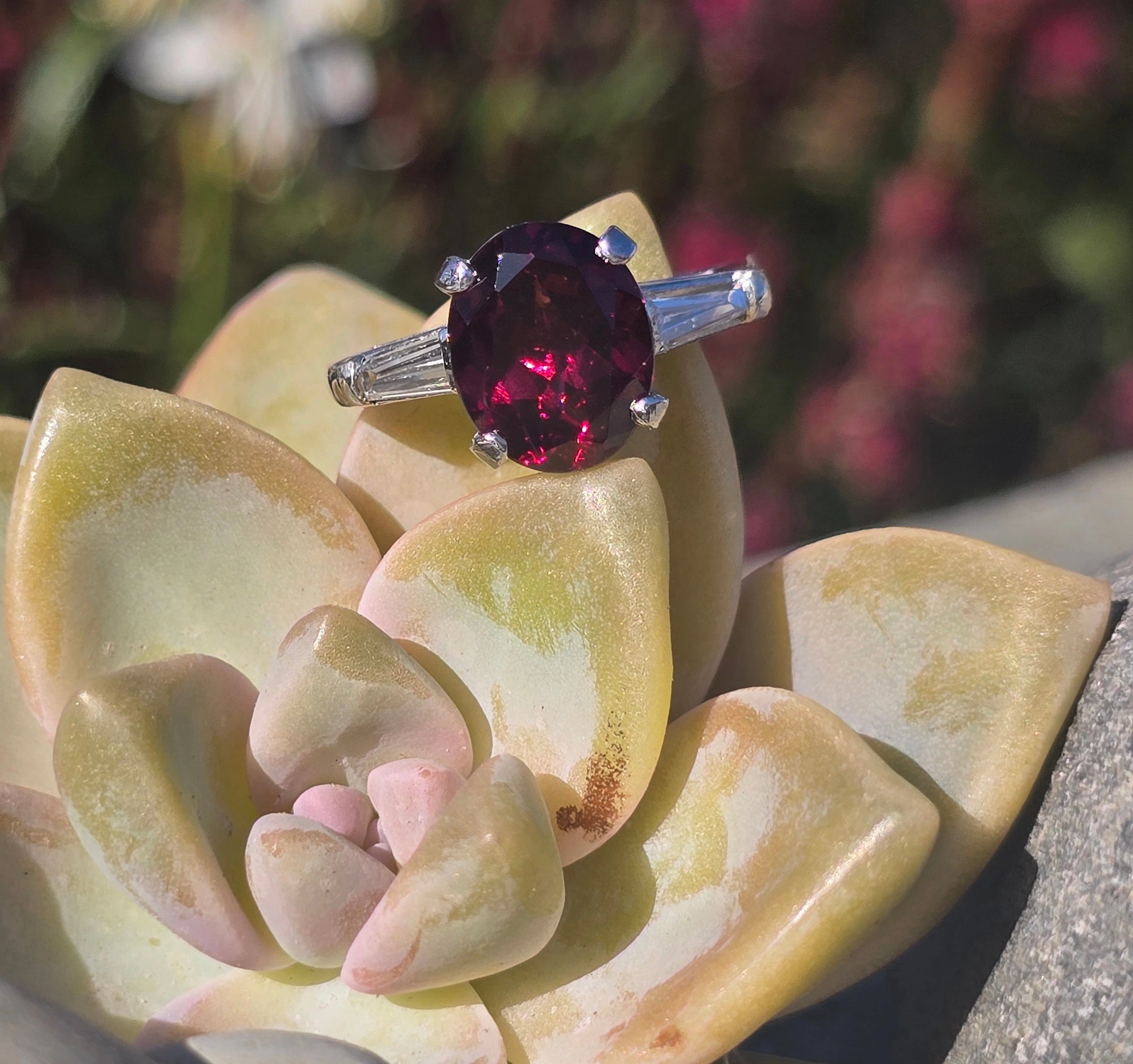 Platinum garnet and baguette diamond estate ring