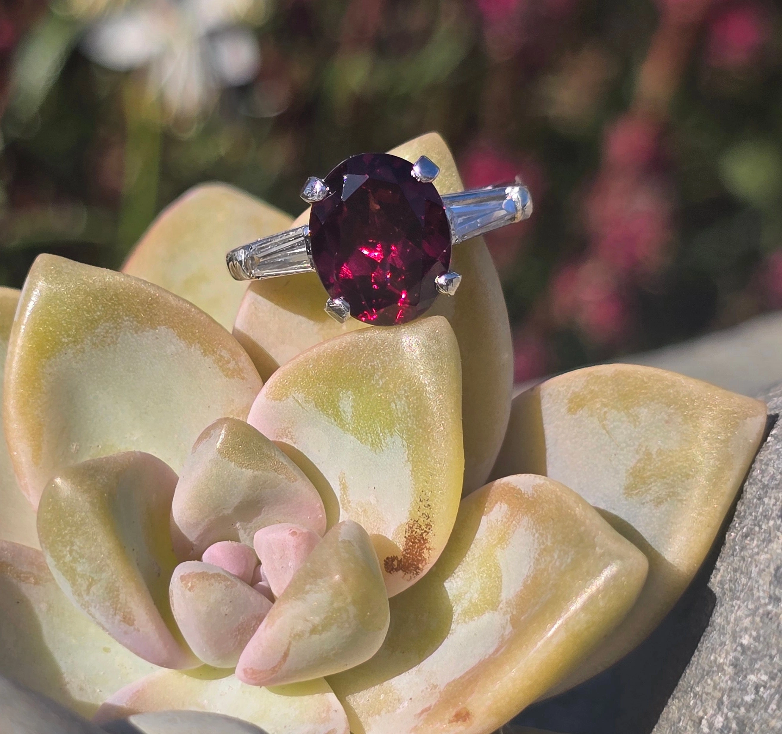 Platinum garnet and baguette diamond estate ring