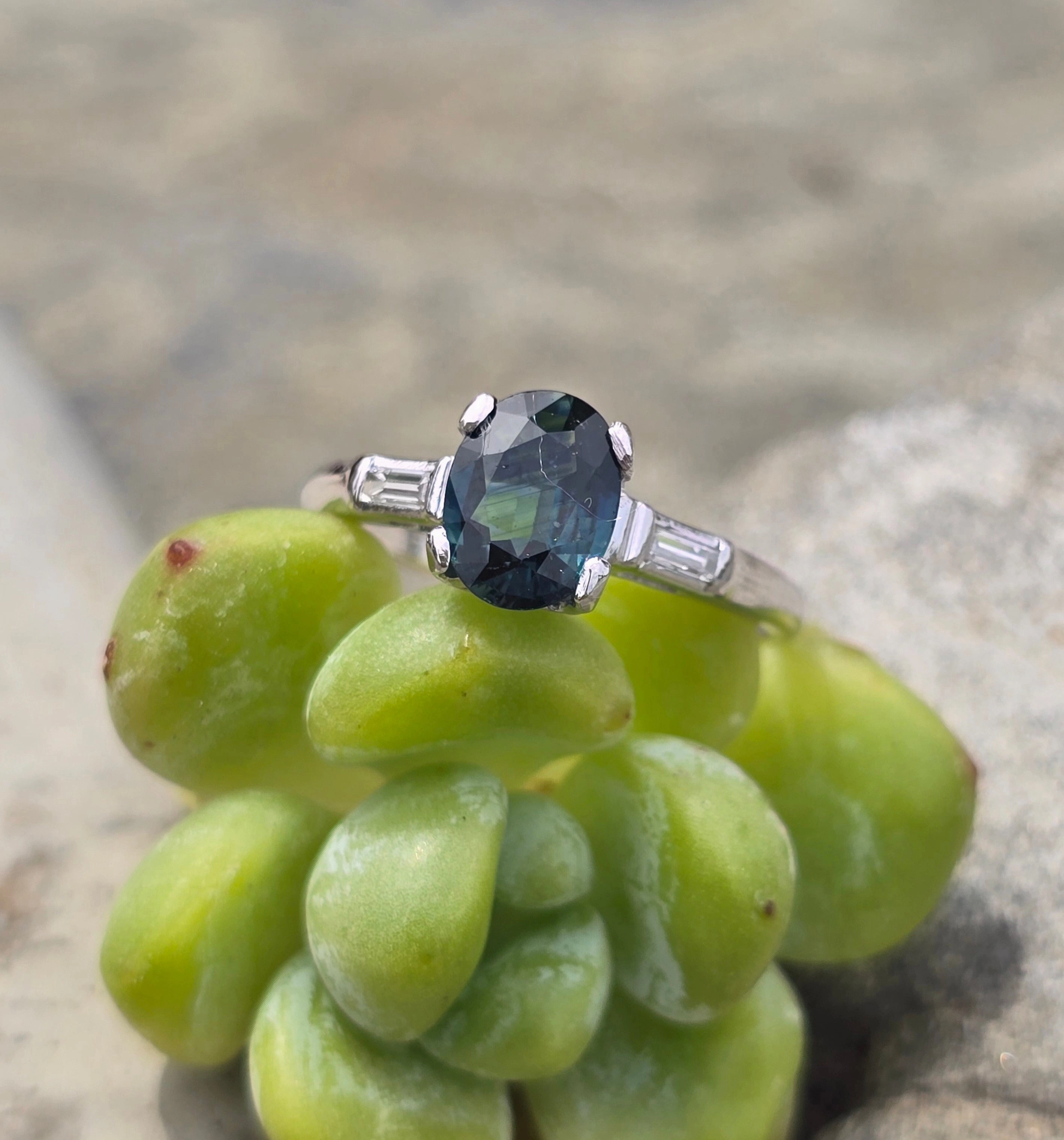 Platinum greenish blue sapphire and baguette diamond estate ring
