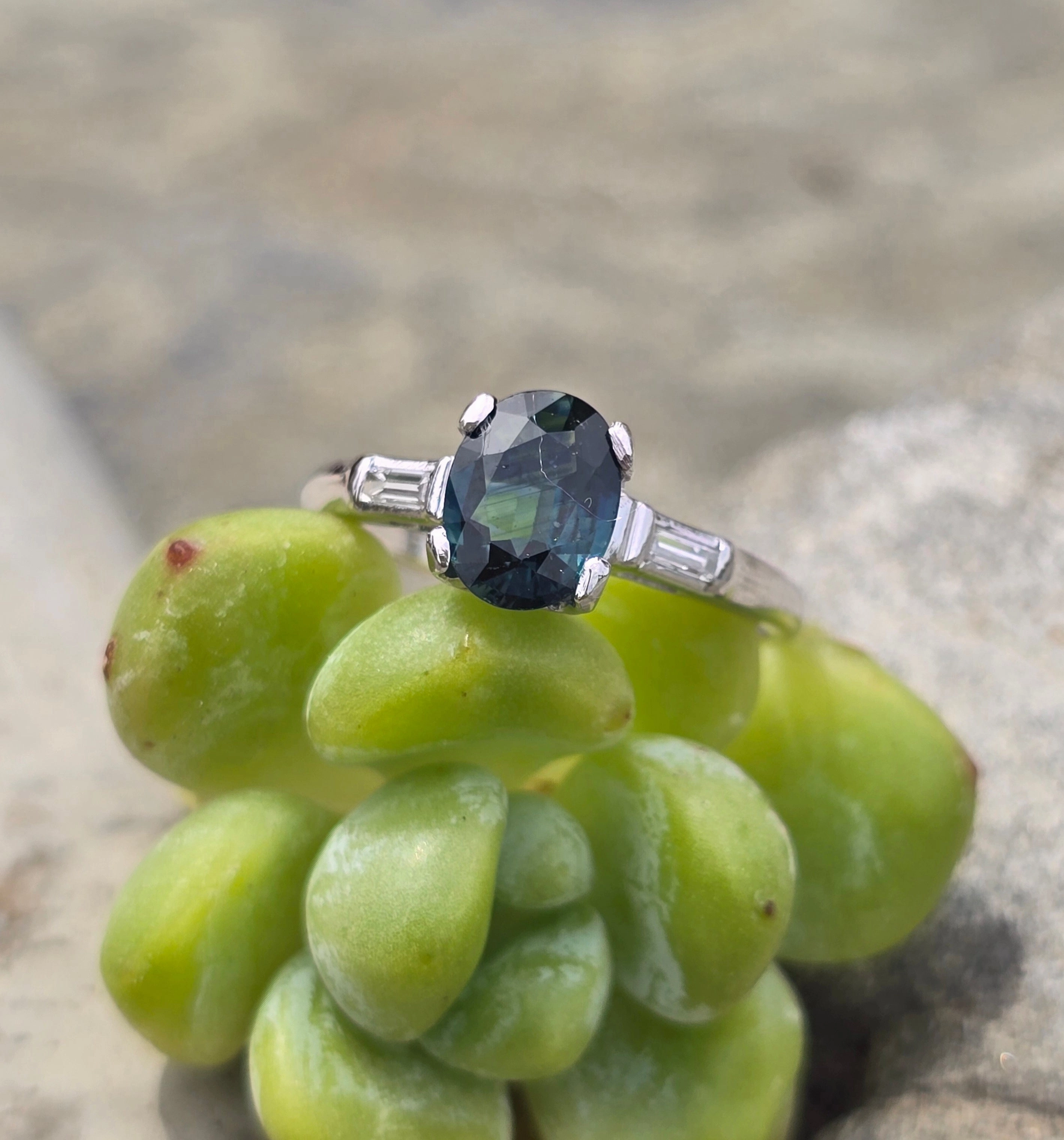 Platinum greenish blue sapphire and baguette diamond estate ring